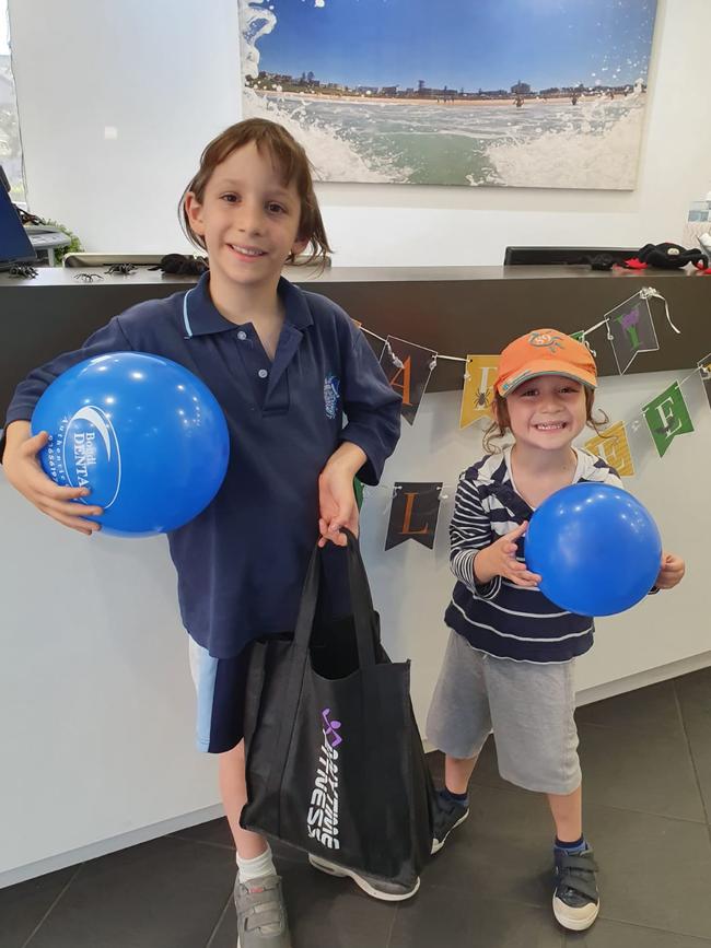 Kids handing in their candy for the trick or treat buyback at Bondi Dental.