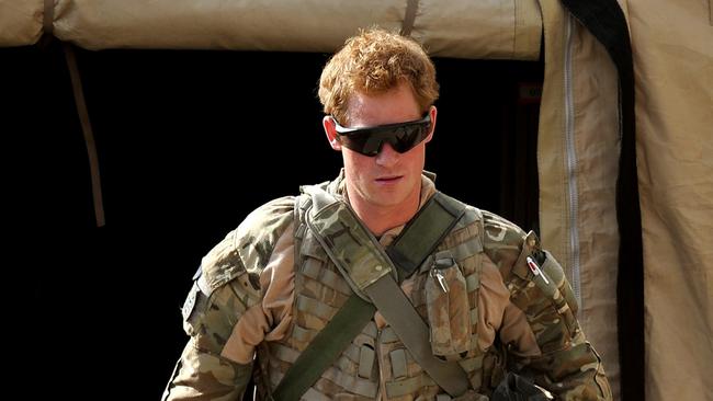 Prince Harry walking out of a tent at the British controlled flight-line at Camp Bastion in Afghanistan's Helmand Province. Picture: AFP.