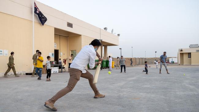 Afghanistan evacuees play cricket at the temporary camp in Australia's main operating base in the Middle East. Picture: ADF