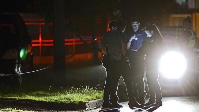 Police at the scene after the random bashing of 77-year-old grandmother, Le Le. Picture: Patrick Herve