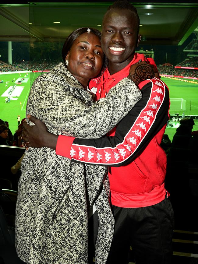 Awer Mabil with mother Agot Atem after he signed with Denmark’s FC Midtjylland. Picture: Mark Brake