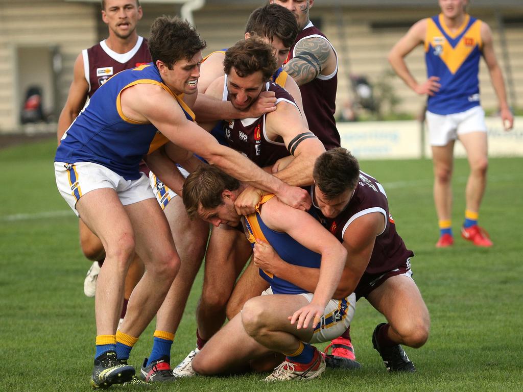 Ballarat: Sebastopol’s Conor Dickson is set upon by Melton players after an off the ball incident with Lachlan Walker. Picture: Hamish Blair