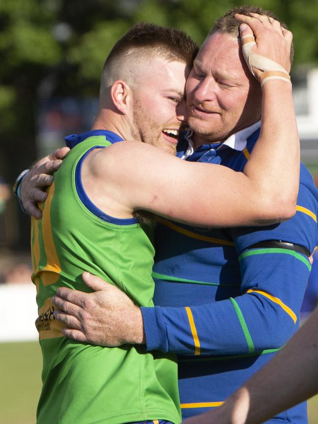 Golden Grove coach Eric Kells with best-on-ground medallist Michael Walters after the side claimed the third tier Adelaide Footy League premiership. Picture: Emma Brasier