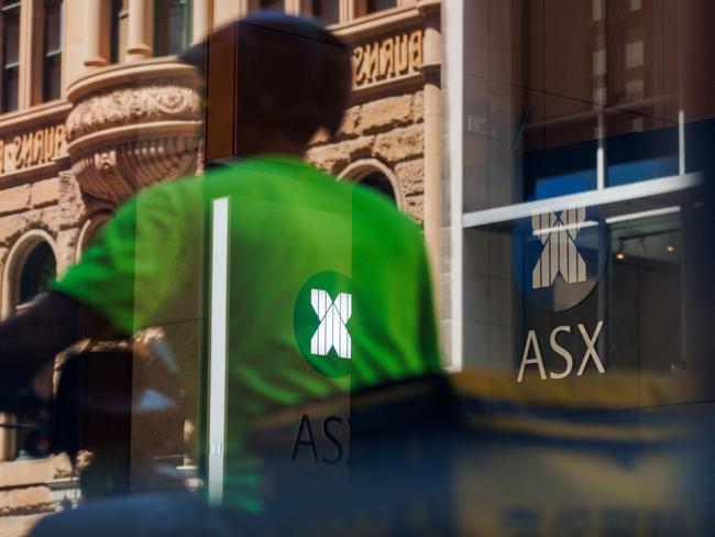 SYDNEY, AUSTRALIA - NewsWire Photos, October 29 2024. GENERIC. Stocks. Finance. Economy. A food delivery rider passes the Australian Stock Exchange, ASX, on Bridge Street. Picture: NewsWire / Max Mason-Hubers