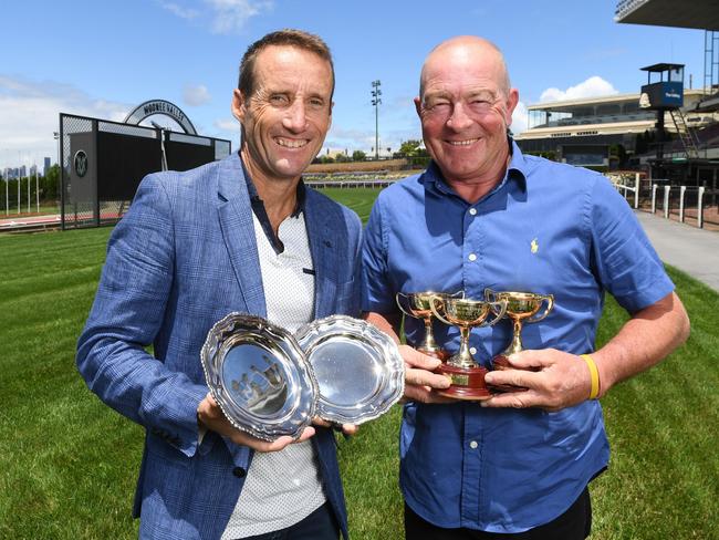 Retired champion Damien Oliver with master driver Chris Alford as he closes in on his 8000th winner. Picture: Josie Hayden,