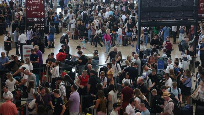 Travellers stuck at Berlin airport on Friday morning, local time (Friday evening AEST), as the global internet outage hit Europe. Picture: Getty Images