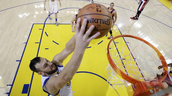 Golden State Warriors' Andrew Bogut dunks against the Portland Trail Blazers during the first half.
