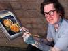 Tattoo artist brushes skin for different canvas