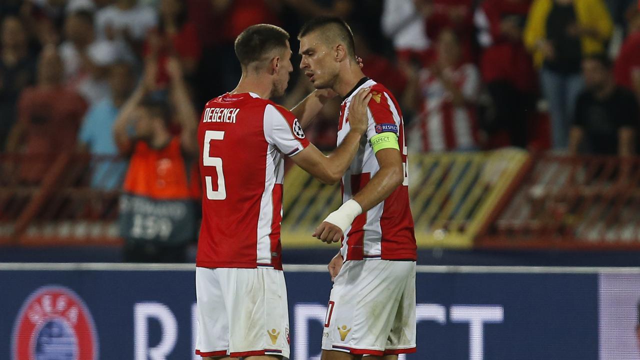 Job well done: Degenek and Vujadin Savic celebrate after holding Napoli scoreless.