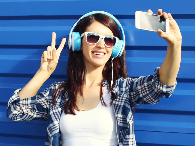 A young woman taking a selfie using her mobile phone. Picture: iStock.