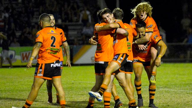 Wests Tigers players celebrate their 42-18 RLMD A-Grade grand final victory over Townsville Brothers. Photo: Callum Dick