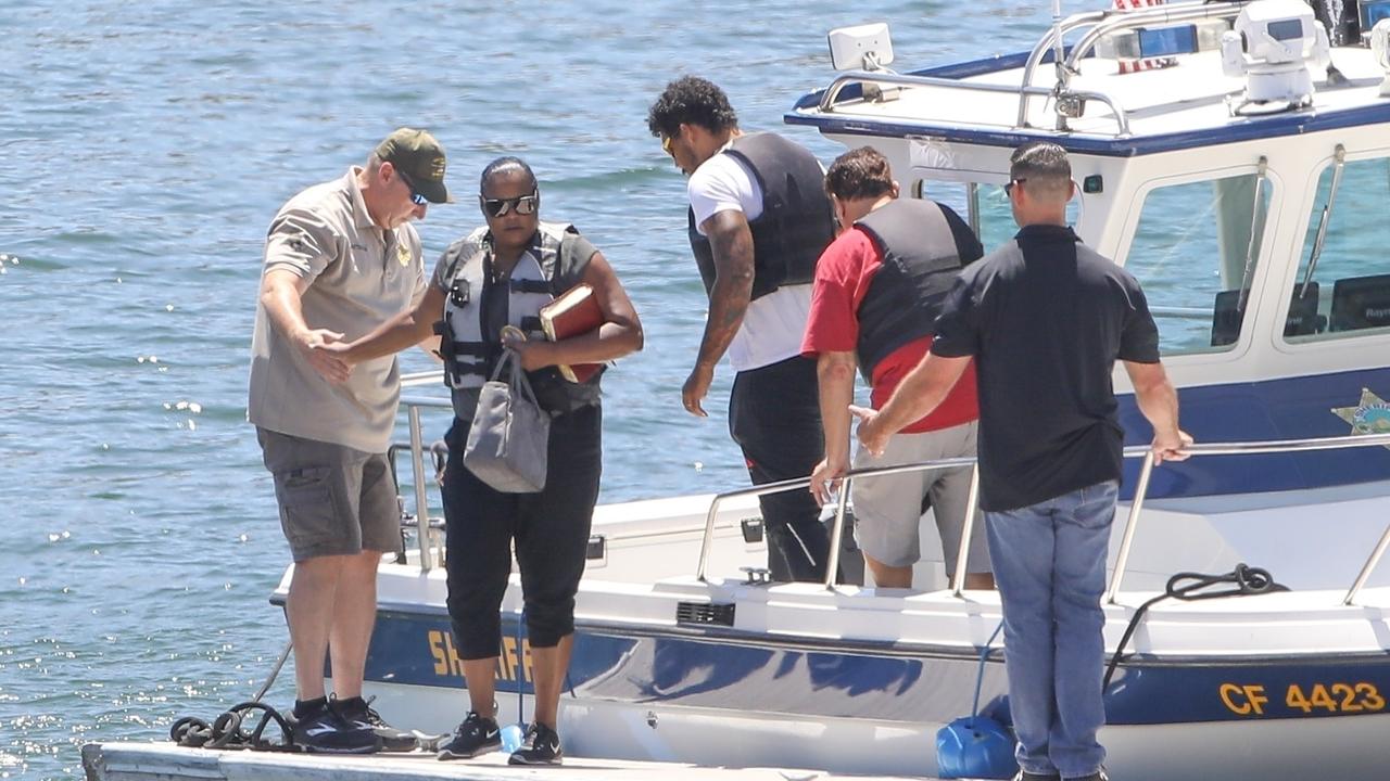 The family head out on a boat to join the search. Picture: JACK / BACKGRID