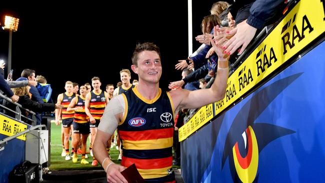 Matt Crouch soaks up the applause of the Crows fans after his milestone match. Picture: AAP Image/Sam Wundke.