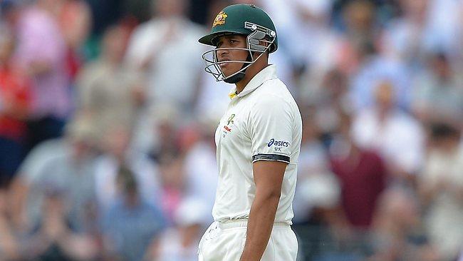 Australia's batsman Usman Khawaja walks off dejectedly after being given out caught behind at Old Trafford even though upon review Hot Spot gave no evidence of an edge