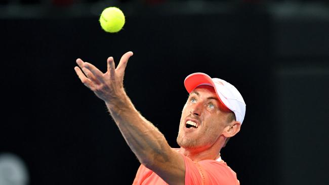 John Millman in action against Tennys Sandgren of the USA on day one of the Brisbane International tennis tournament at the Queensland Tennis Centre in Brisbane. Picture: AAP/Darren England