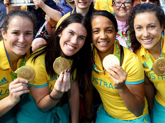 Rugby 7's Gold Medalist Shannon Parry, Charlotte Caslick, Amy Turner and Emilee Cherry at the welcome home parade through Brisbane. Pic Darren England.