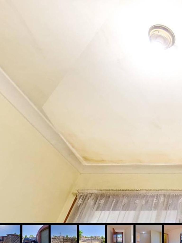 One Reddit user shared an image of a badly edited bathroom ceiling, with a clear line where stains had been covered. Picture: Reddit.