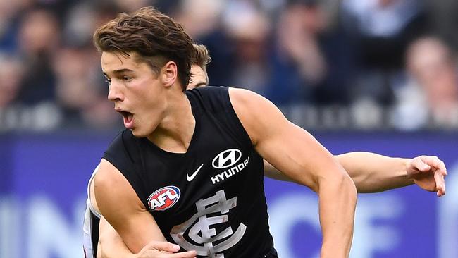 MELBOURNE, AUSTRALIA - MAY 11: Liam Stocker of the Blues handballs whilst being tackled during the round eight AFL match between the Carlton Blues and the Collingwood Magpies at Melbourne Cricket Ground on May 11, 2019 in Melbourne, Australia. (Photo by Quinn Rooney/Getty Images)