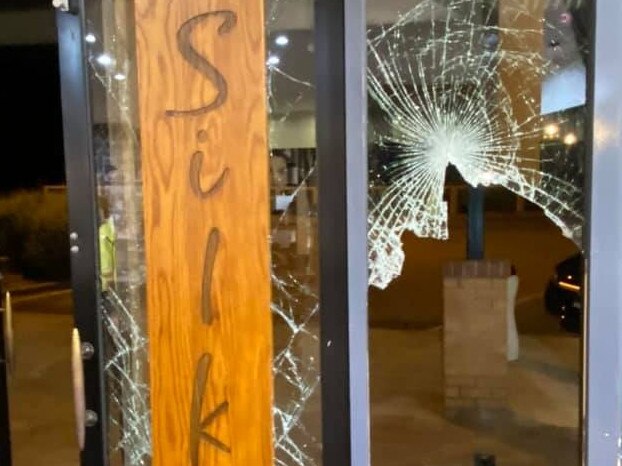 Smashed front door at Silk Hair Skin Body, Mt Martha.