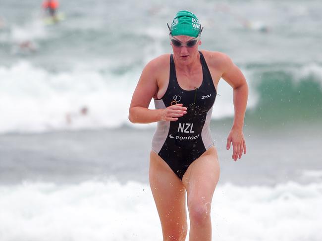 Stefannie Gillespie crosses the line in the North Bondi Roughwater ocean swim. Picture: Carly Earl.