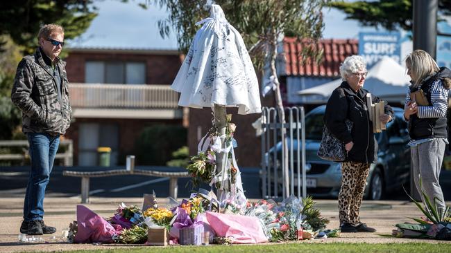 Local Alex Andrews pays his respects at a memorial in Cowes. Picture: Jake Nowakowski