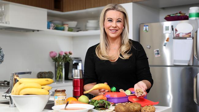 Leading dietitian Susie Burrell with some healthy, back-to-the-office lunch options. Picture: Jonathan Ng