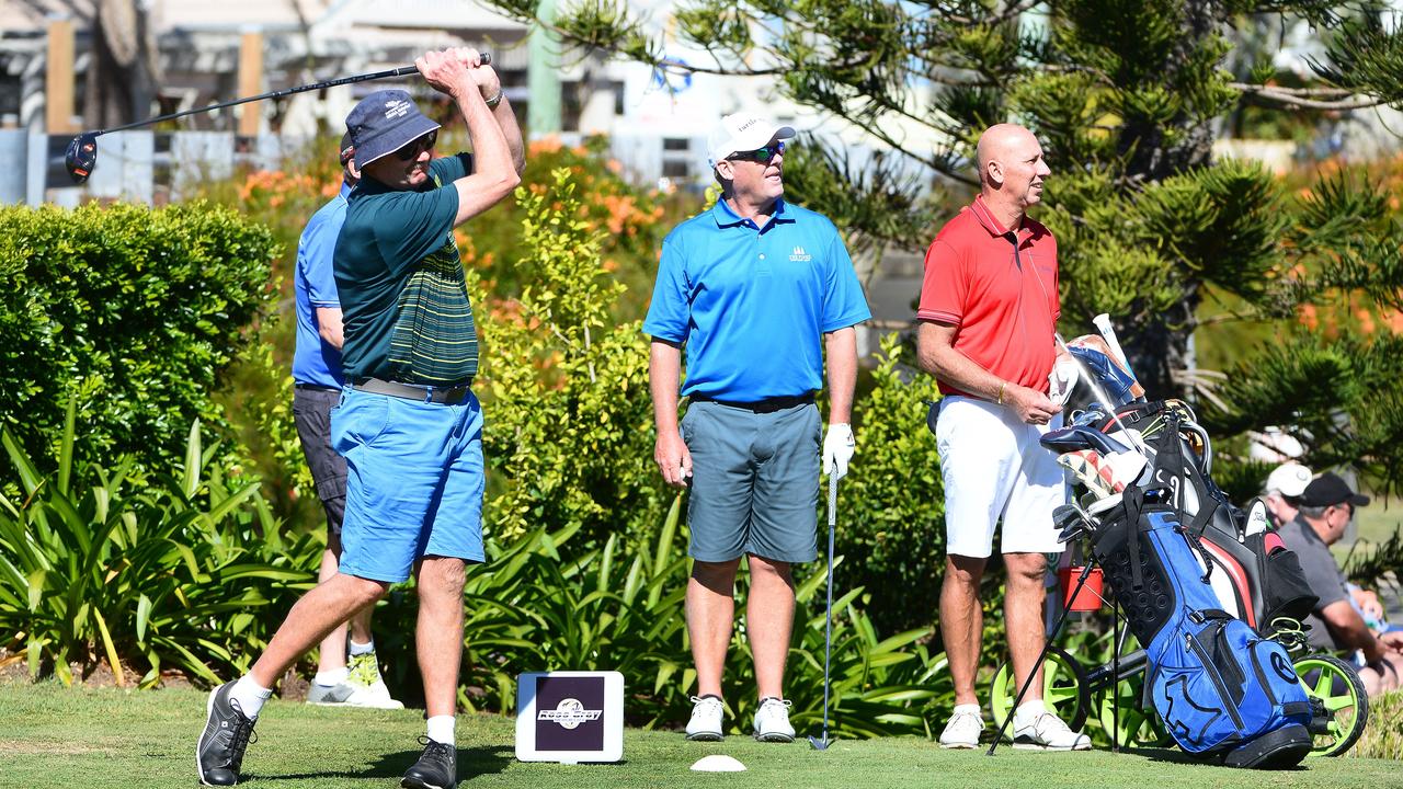 Mark Ramsay tees off on the tenth at Bargara Golf Club. Brad Cumming and Ben Jackson watch the ball. Players in groups of up to four will be able to play together at some clubs this weekend. Photo: Mike Knott