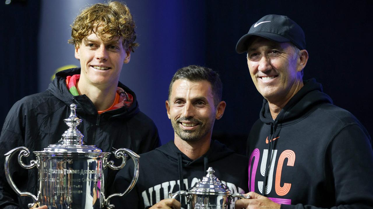 Sinner after his 2024 US Open win with his coaching team Simone Vagnozzi (centre) and Darren Cahill (right). Picture: Matthew Stockman / Getty Images