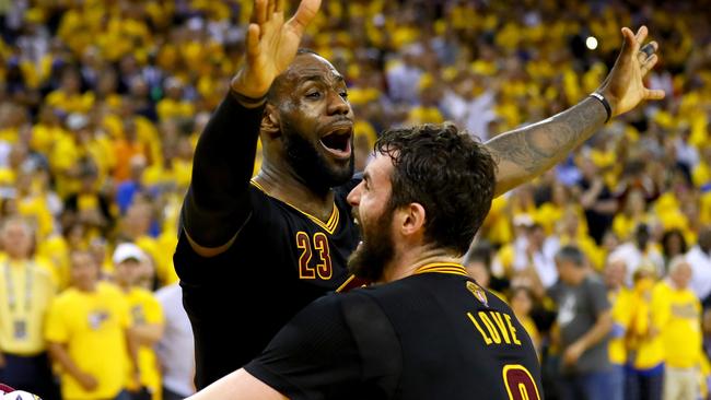 LeBron James and Kevin Love celebrate.