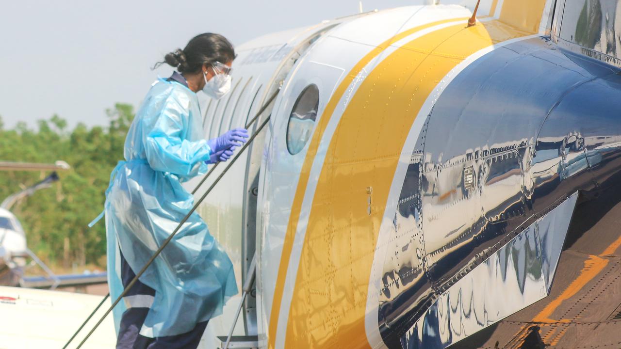 Dr Saras Chauhan boards as CareFlight staff prepare to evacuate Covid cases from Katherine. Picture: Glenn Campbell