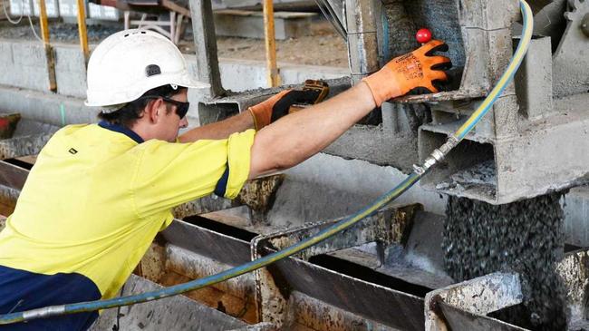 A worker pours concrete in to a pile mould. Picture: Allan Reinikka ROK070217astressc