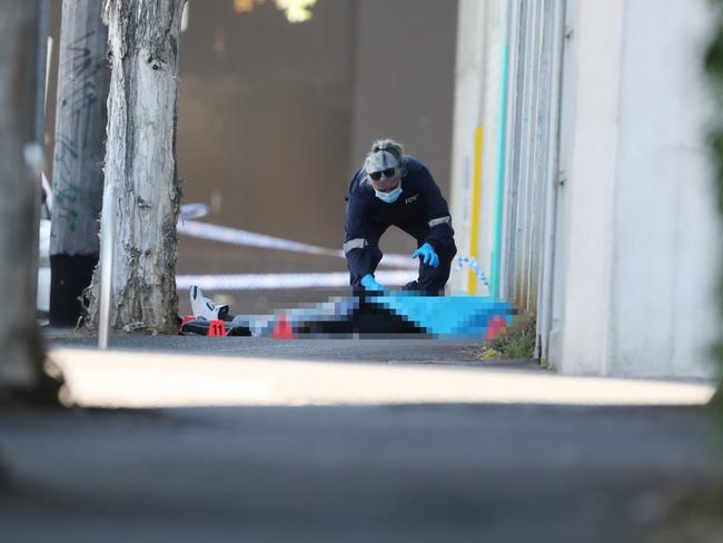 MELBOURNE, AUSTRALIA- NewsWire Photos NOVEMBER 2, 2024: (Body in frame) Scene in North Melbourne where the body of a man has been found shot dead. Picture:  NewsWire/ David Crosling