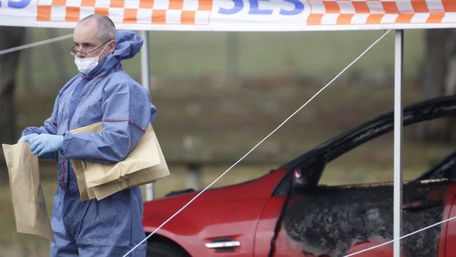 Police on the scene where Mr Pham’s body was found. Picture: Hamish Blair