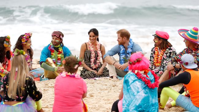 Meghan and Harry talk to members of OneWave. Picture: Getty