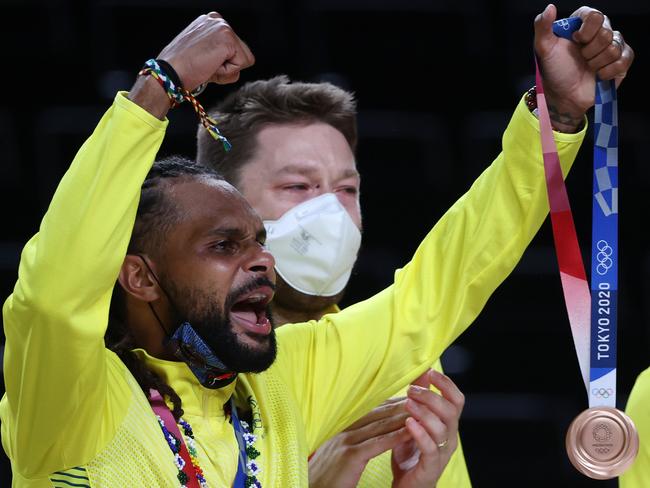 Boomers star guard Patty Mills celebrates with his bronze medal after Australia’s third v fourth playoff match against Slovenia at the Tokyo Olympics. Picture: Kevin C Cox/Getty Images