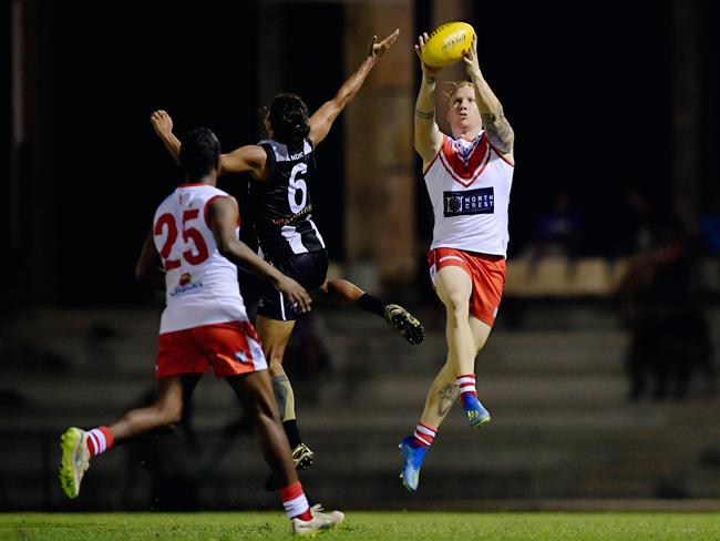 Palmerston Magpies versus Waratahs in the NTFL season opening match at Asbuild Oval. Ryan Bulluss (21) takes a mark