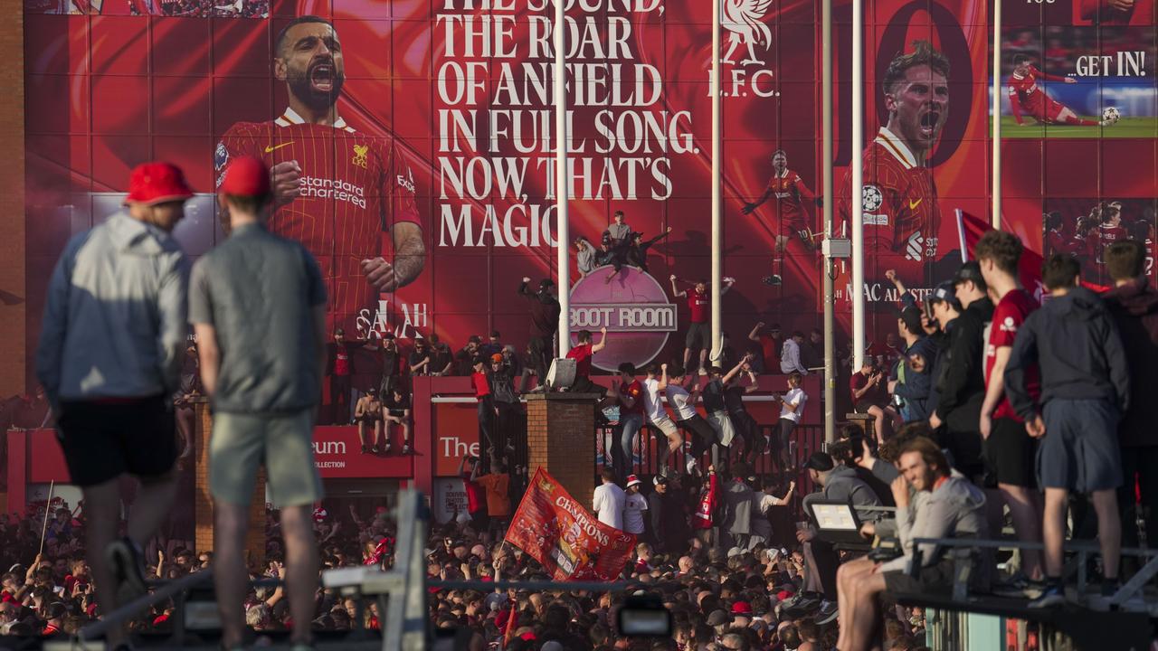 Liverpool supporters celebrate outside of Anfield. AP Photo/Jon Super.