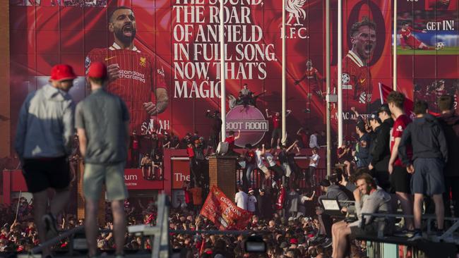 Liverpool supporters celebrate outside of Anfield. AP Photo/Jon Super.