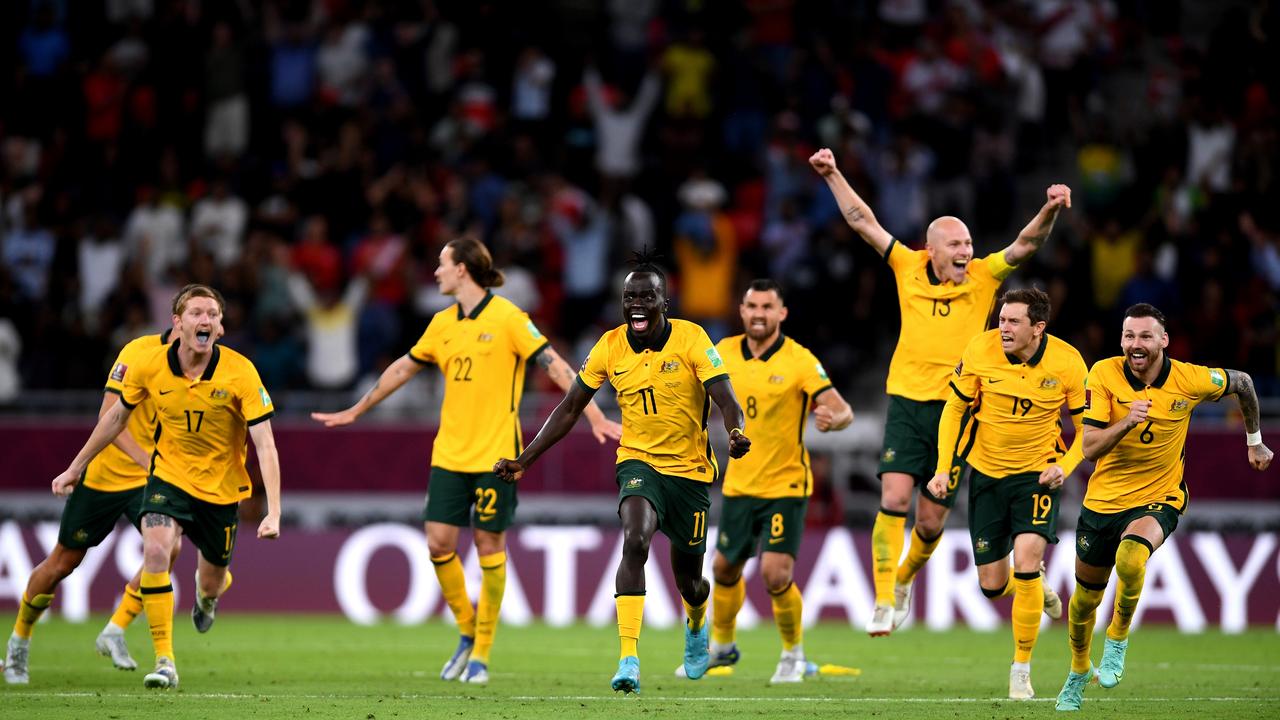 DOHA, QATAR - JUNE 13: Australia celebrate after defeating Peru in the 2022 FIFA World Cup Playoff match between Australia Socceroos and Peru at Ahmad Bin Ali Stadium on June 13, 2022 in Doha, Qatar.  (Photo by Joe Allison/Getty Images)