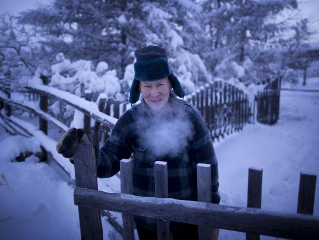 Alexander Platonov, 52, a retired teacher, dressed for a quick dash to the outdoor toilet.