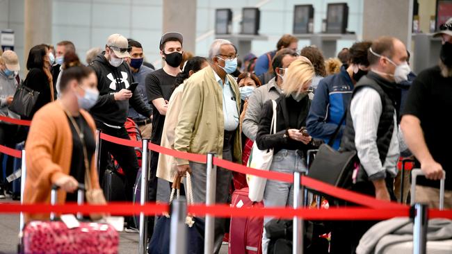 Crowds at the Brisbane domestic airport as people arrive or escape for the long weekend Picture: NCA NewsWire