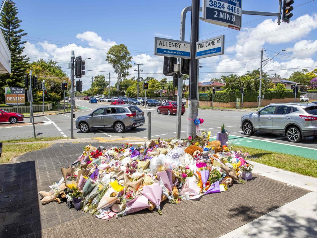 Flowers for Kate Leadbetter and Matthew Field at the intersection of Vienna and Finucane Roads at Alexandra Hills. The couple were killed by a stolen car-driving teen who has since been jailed. Picture: Richard Walker