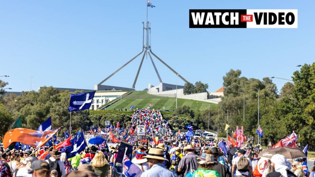 Thousands of anti-vaccine protesters march to Parliament House in Canberra