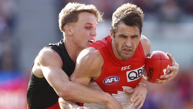 Dylan Clarke puts the clamps on Sydney star Josh Kennedy. Picture: AAP Image/Daniel Pockett.