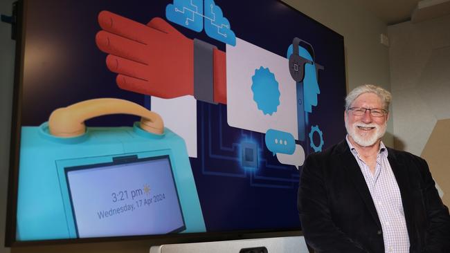 Head of Major Projects at Deakin University’s Applied AI Institute Dr Simon Parker with an image of the device that will help improve the lives of people living with dementia. Picture: Alison Wynd