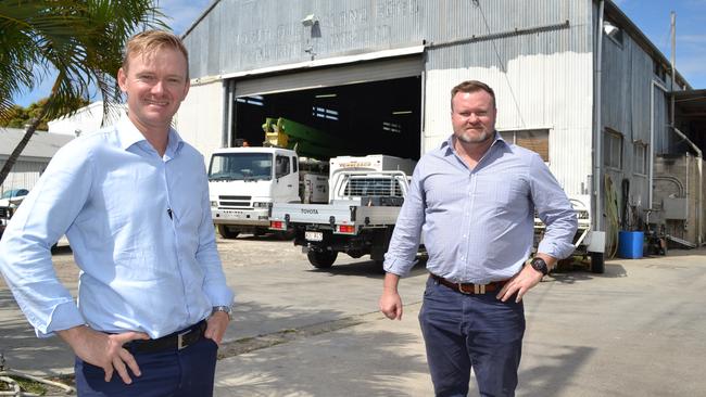 Colliers agents Neville Smith and Aaron Power at the Idalia industrial shed, at one time a former cinema, which is for sale.