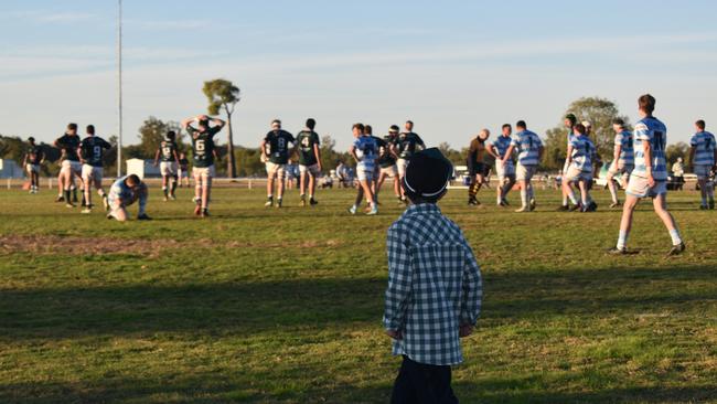 Spectators cheer on as they watch the A Grade Roma vs Condamine match at the Roma Rugby Races at Bassett Park. Picture: Chloe Cufflin.