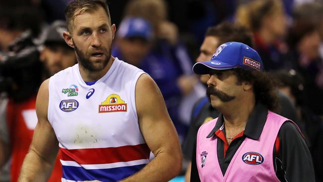 Travis Cloke with the club doctor. Picture: Michael Klein