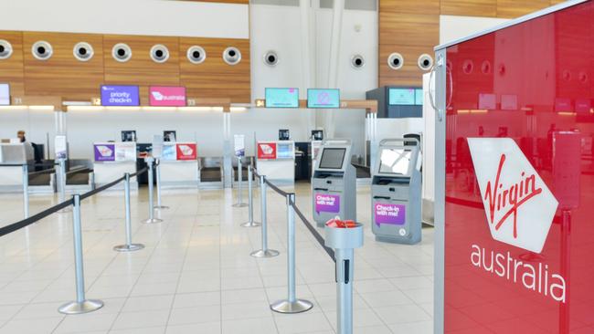 The empty check-in area for Virgin Australia at Adelaide Airport on Tuesday. Picture: Brenton Edwards/AFP