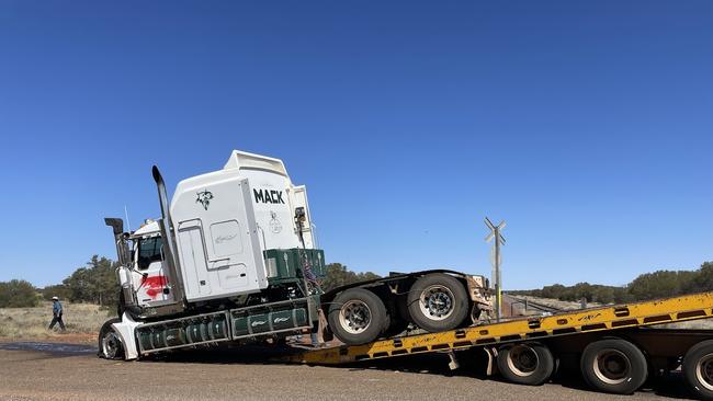 The cab of a cattle truck being loaded onto a trailer to be towed after it collided with The Ghan at railway tracks 45km out of Alice Springs on Sunday, September 15, 2024. Photo: Gera Kazakov